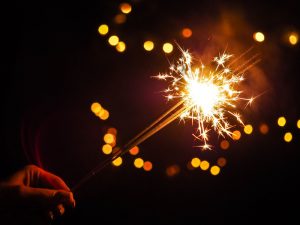 Person holding sparklers